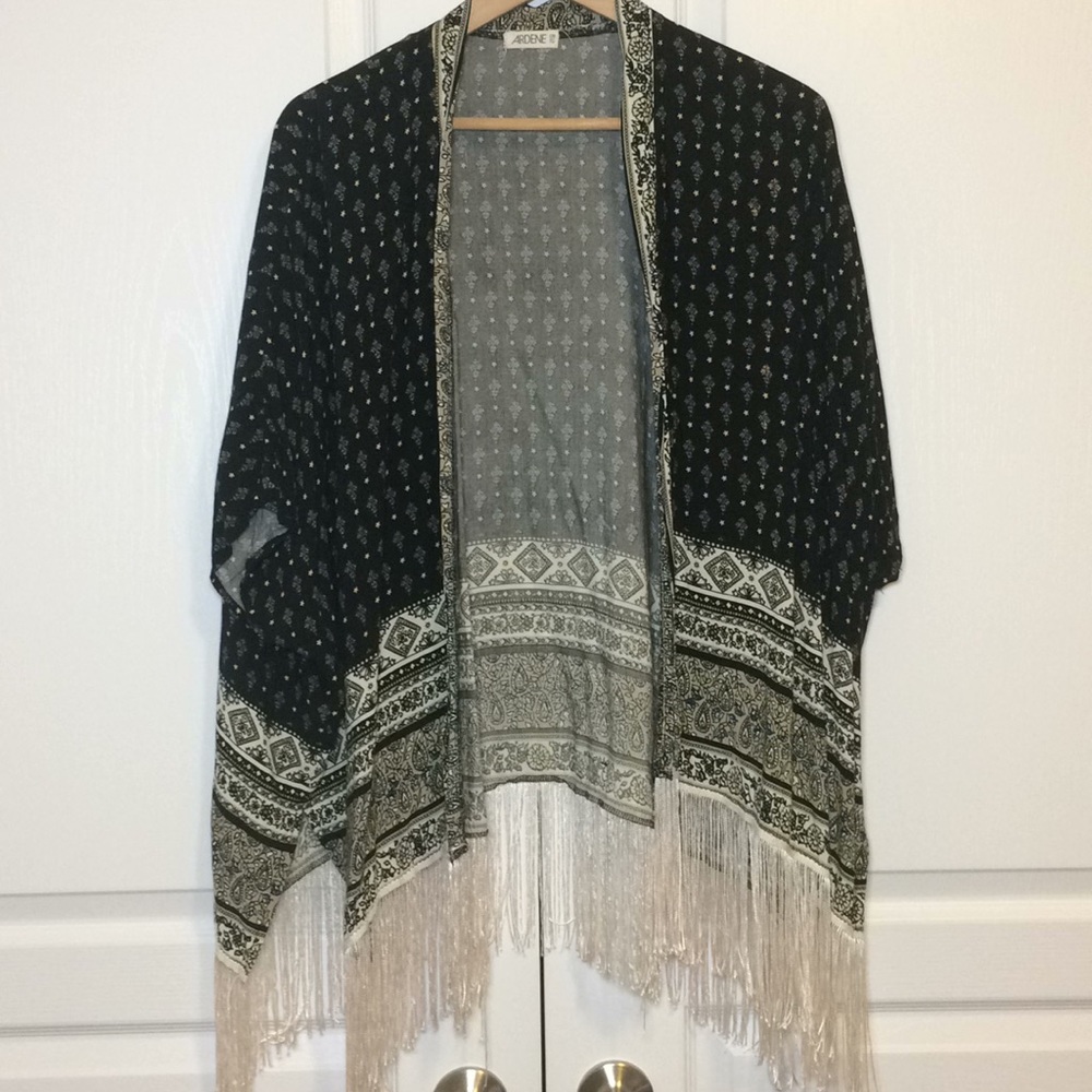 Ardene shrug with tassel hem